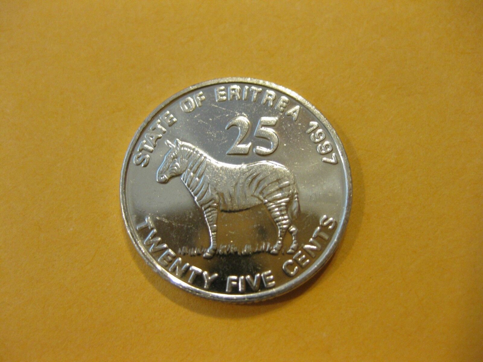 ERITREA 25 Cents Coin; UNCIRCULATED, 1997; KM46; features Grevy's Zebra and Independence Soldiers
