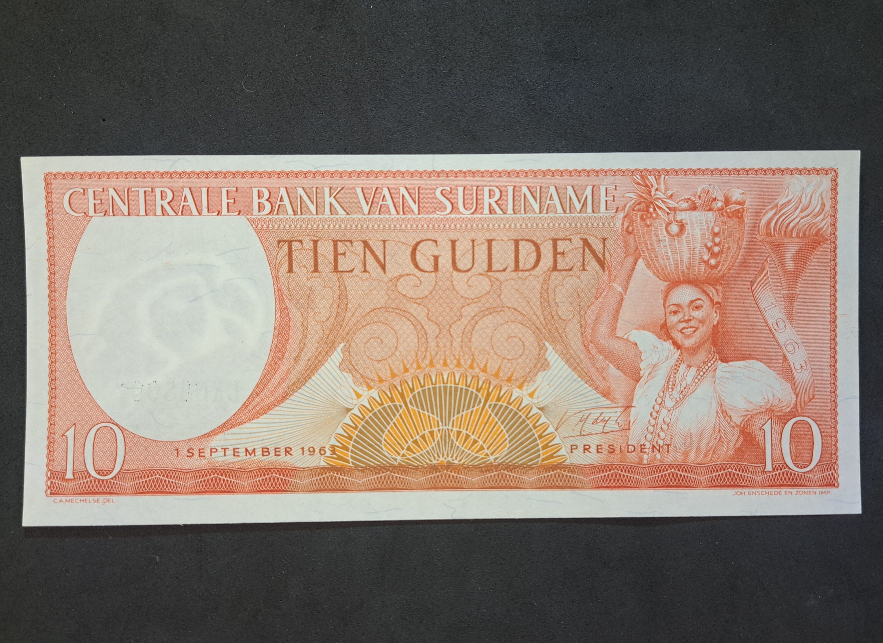 SURINAME 10 Gulden Banknote; P- 121b, UNC; 1963; features a Toucan