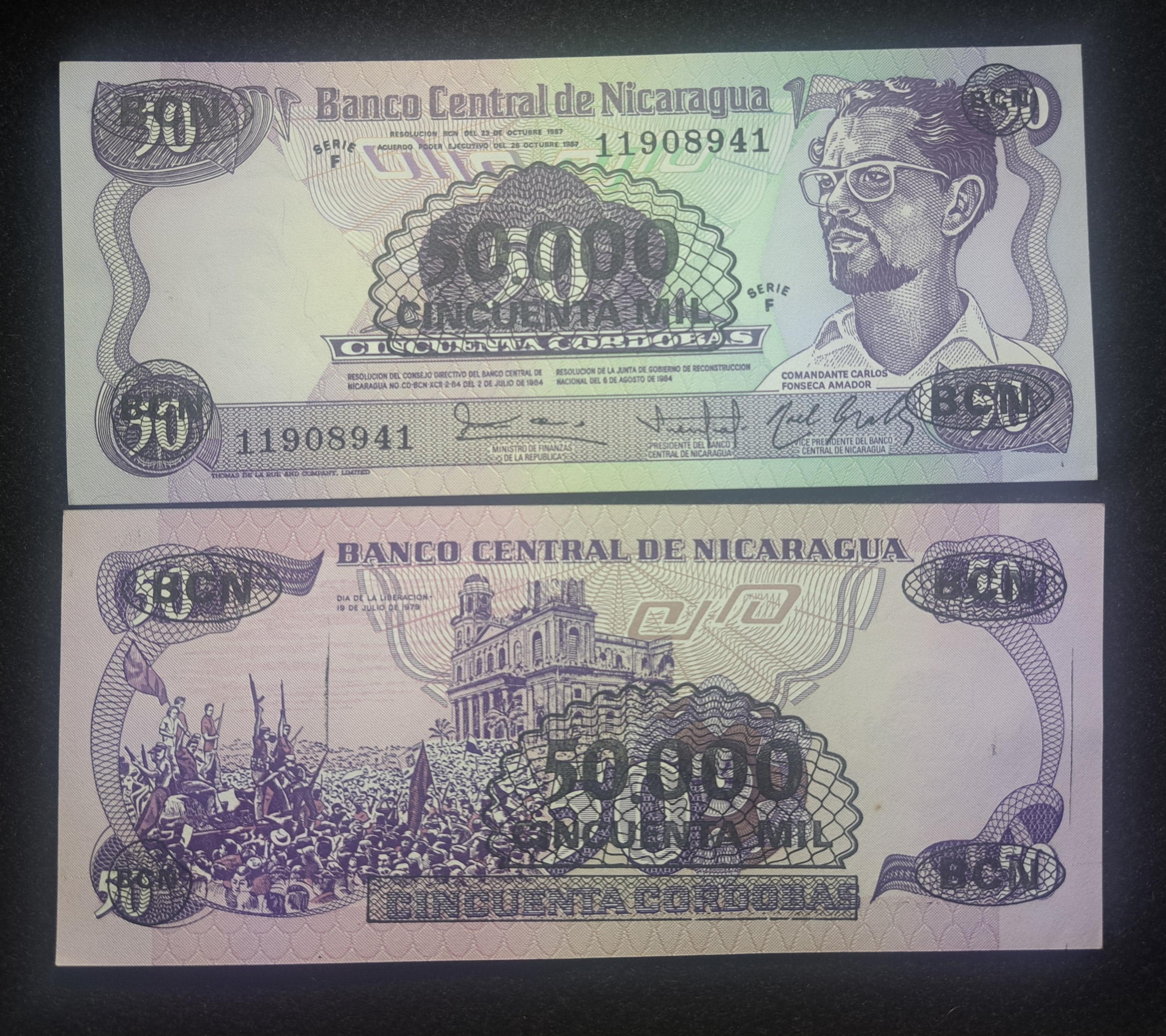 NICARAGUA 50000 Cordobas Overprint Banknote; P-148; UNCIRCULATED, 1987; features Marching troops
