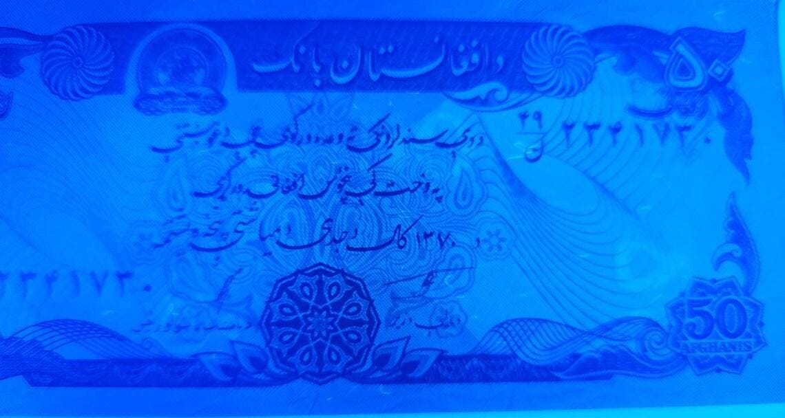 Afghanistan 50 Afghanis; P57a; UNCIRCULATED, 1979; horsemen, Dar-al-Aman Palace