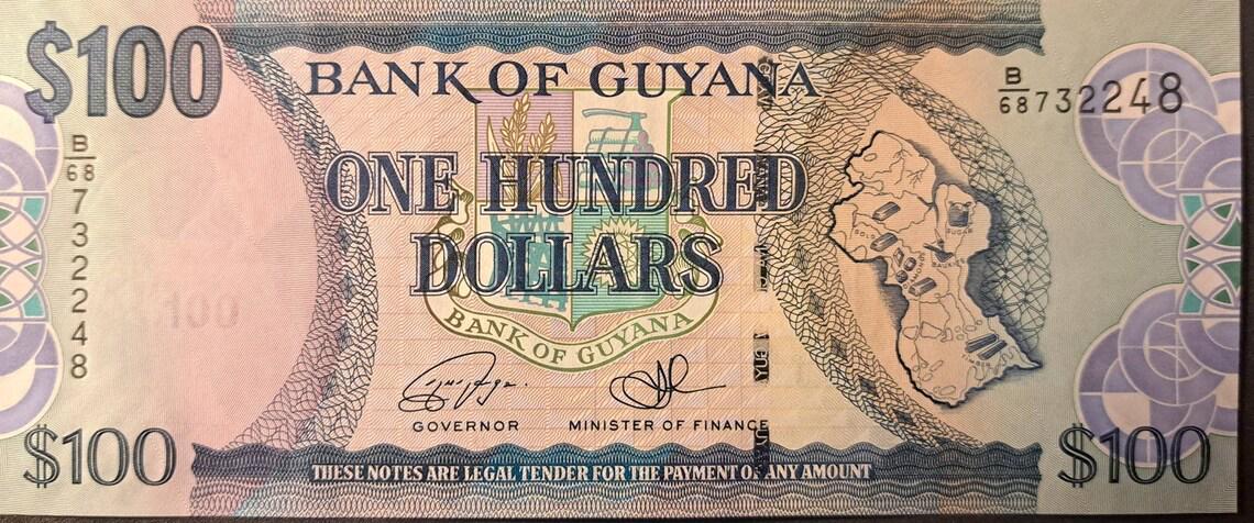 GUYANA 100 Dollars, B-114d, 2022, New Signatures; UNCIRCULATED; Cathedral; Map