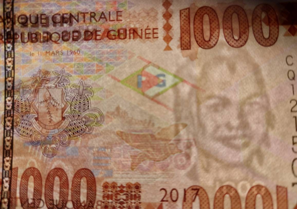 GUINEA 1000 Francs Banknote; P - 48b; UNCIRCULATED; from 2017 featuring Young Woman and Dump Truck