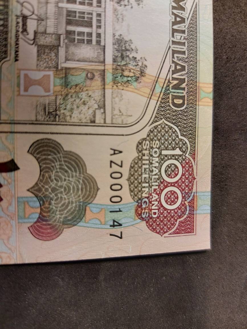 SOMALILAND  100 Shillings, P-5b, Uncirculated, 1996; Super LOW SERIAL number AZ000147; Featuring a Goat Ship