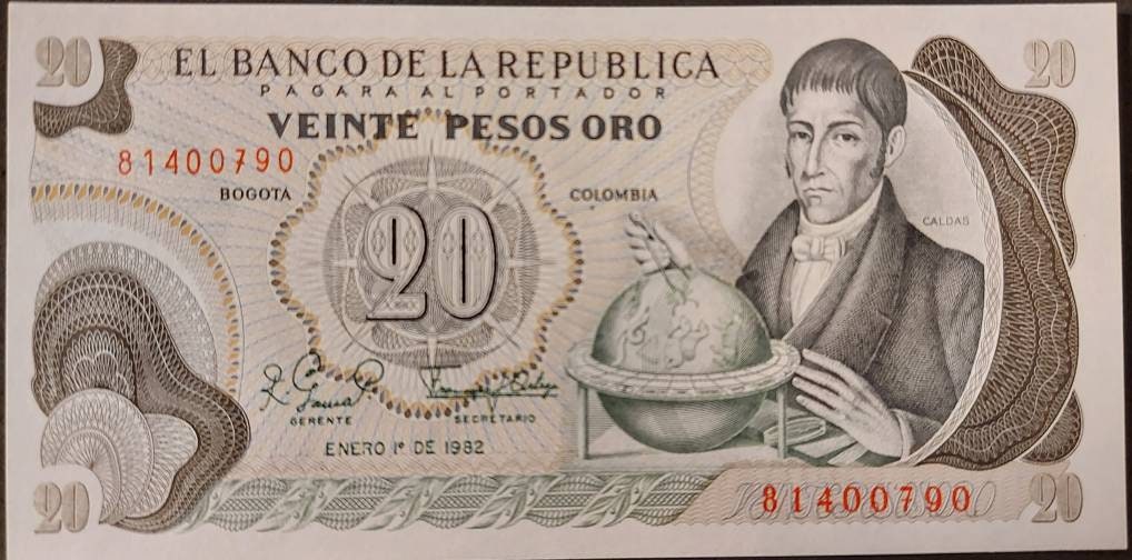 COLOMBIA 20 Peso Oro Banknote; P-409d; UNCIRCULATED from 1982; features Gold trinkets