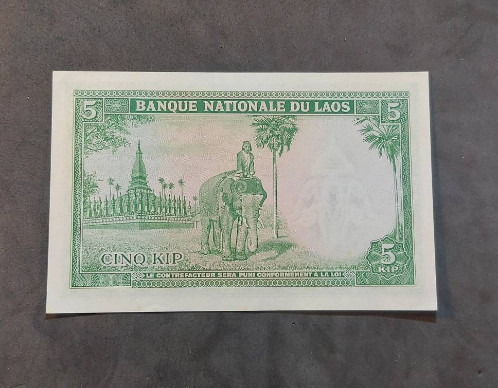 LAOS 5 Kip Banknote; P-9b from 1962; Uncirculated; Large note; Features a beautiful ELEPHANT and rider
