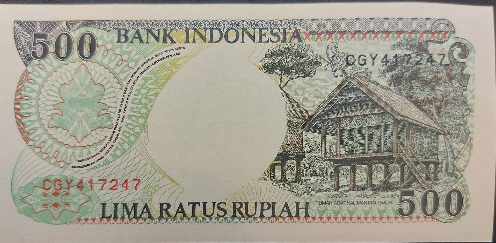 INDONESIA 500 Rupiah, P- 128g; UNCIRCULATED from 1998; features an Orangutan; Native Huts at back