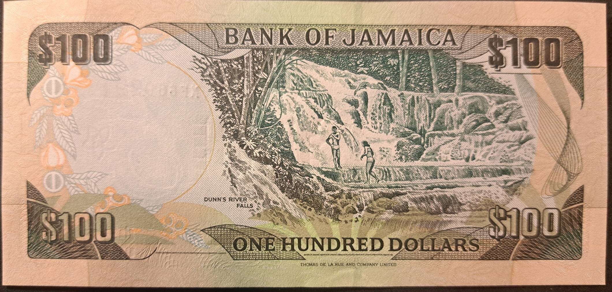 JAMAICA 100 Dollars Banknote; P-80d; UNCIRCULATED from 2004 featuring Dunn's River Falls