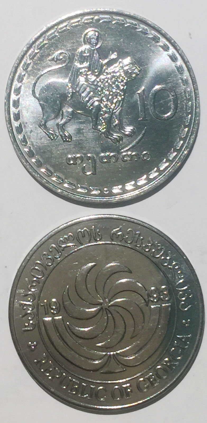 GEORGIA 10 Thetri Coin; UNCIRCULATED from 1993; KM79; features a God riding a Lion and a stylized Candelabra