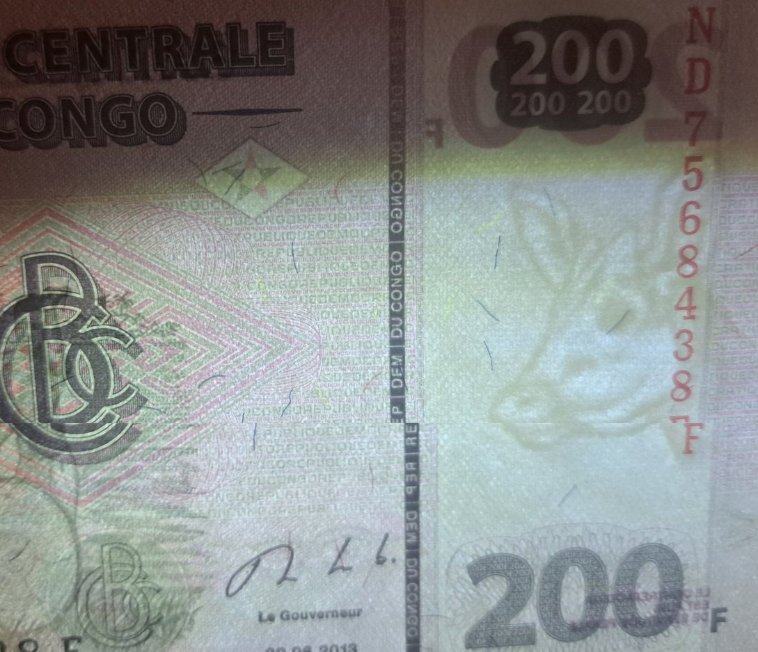 CONGO 200 Francs, P99b, UNCIRCULATED from 2013, features a Large Log Drum