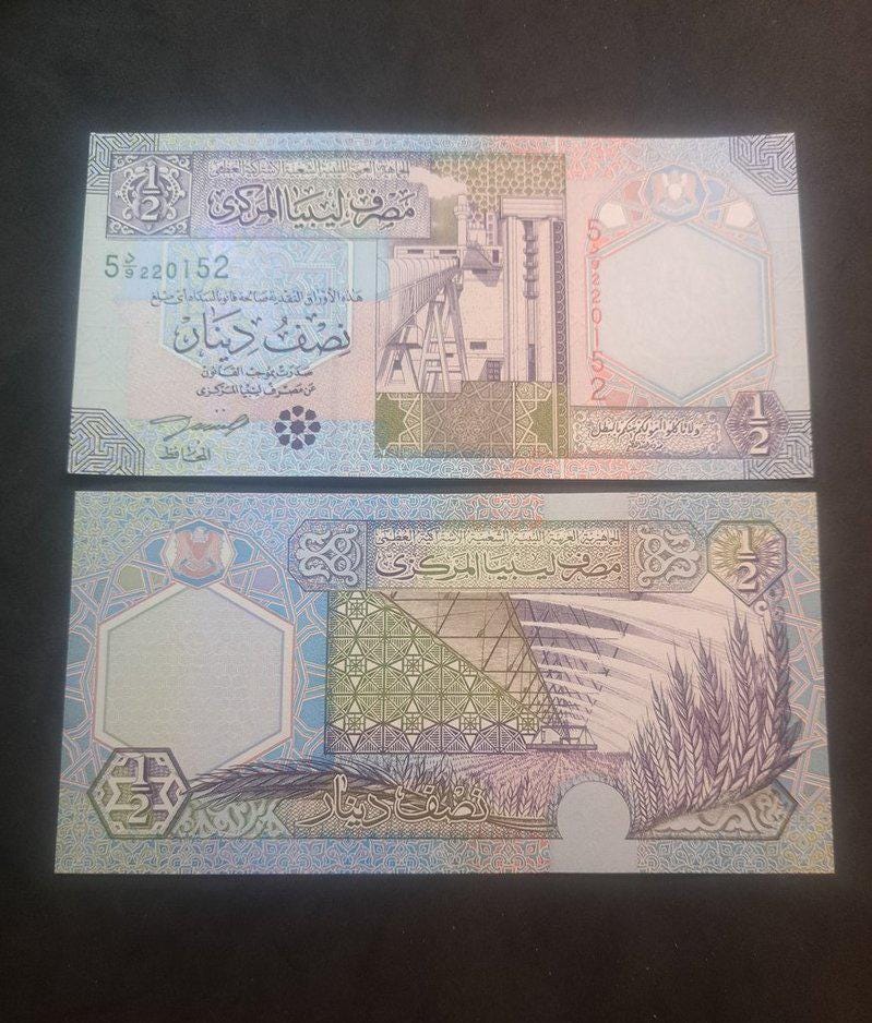 LIBYA 1/2 Dinar, P-63; UNCIRCULATED, 2002; features an Oil Refinery
