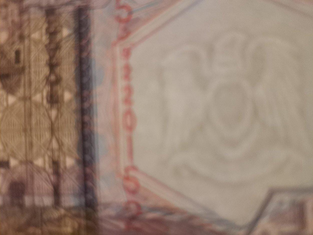 LIBYA 1/2 Dinar, P-63; UNCIRCULATED, 2002; features an Oil Refinery